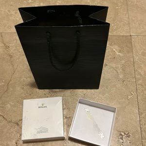 Rolex bag and small figurine box